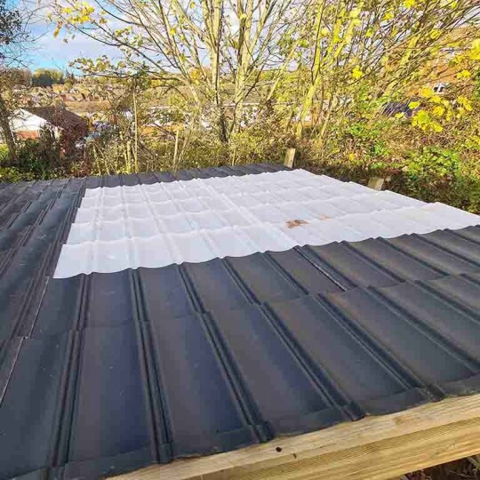 lightweight opaque roof tiles used as a roof window in a garden shed roof by Lightweight Tiles Ltd
