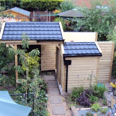 garden shed using budget black roof tiles