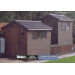 Garden sheds using black plastic roof end caps by Lightweight Tiles 