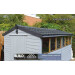 Blue shed with black plastic roof verge covers by Lightweight Tiles