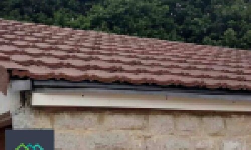 Close up image of brown granulated garage roof replacement by lightweight tiles