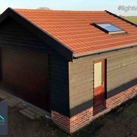 Large Brown plastic garage roof replacement by lightweight tiles