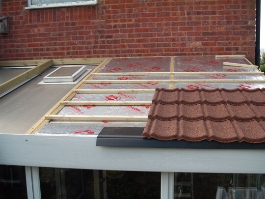 Brown Lean to conservatory installation
