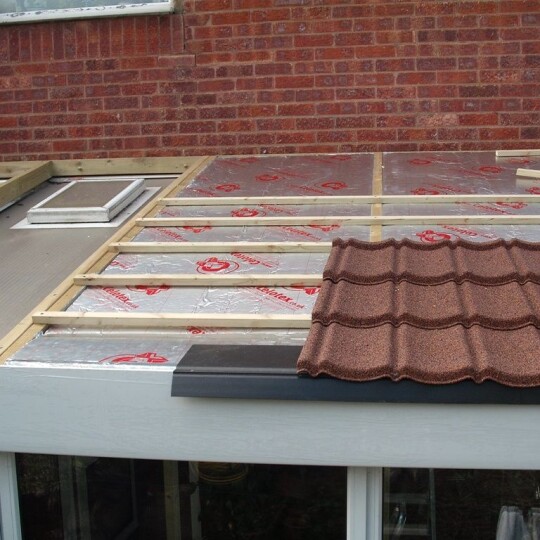 Brown Lean to conservatory installation