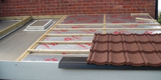 Brown Lean to conservatory installation