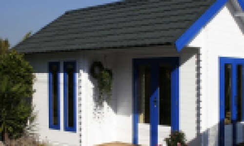 beach hut with grey lightweight roof tiles