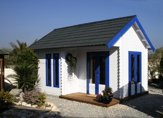 beach hut with grey lightweight roof tiles