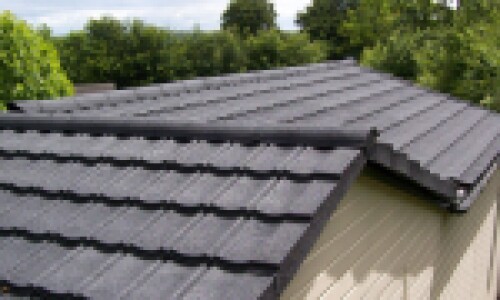 garden office with new lightweight roof tiles in grey