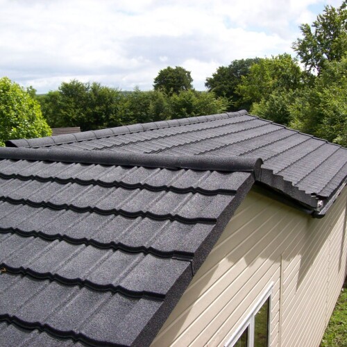 garden office with new lightweight roof tiles in grey